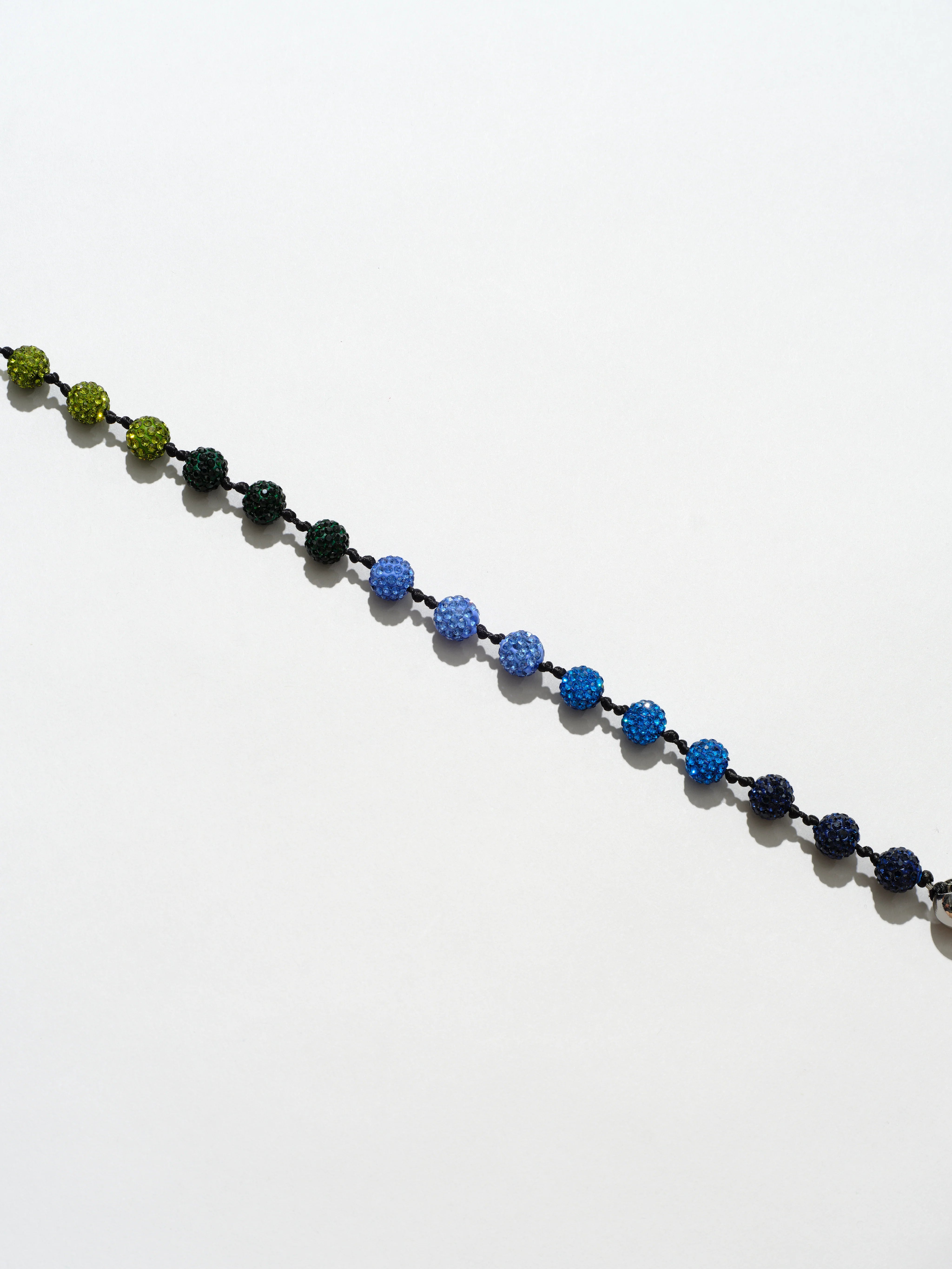 Ossa: Blue Pave Disco Ball Wristlet