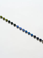 Ossa: Blue Pave Disco Ball Wristlet